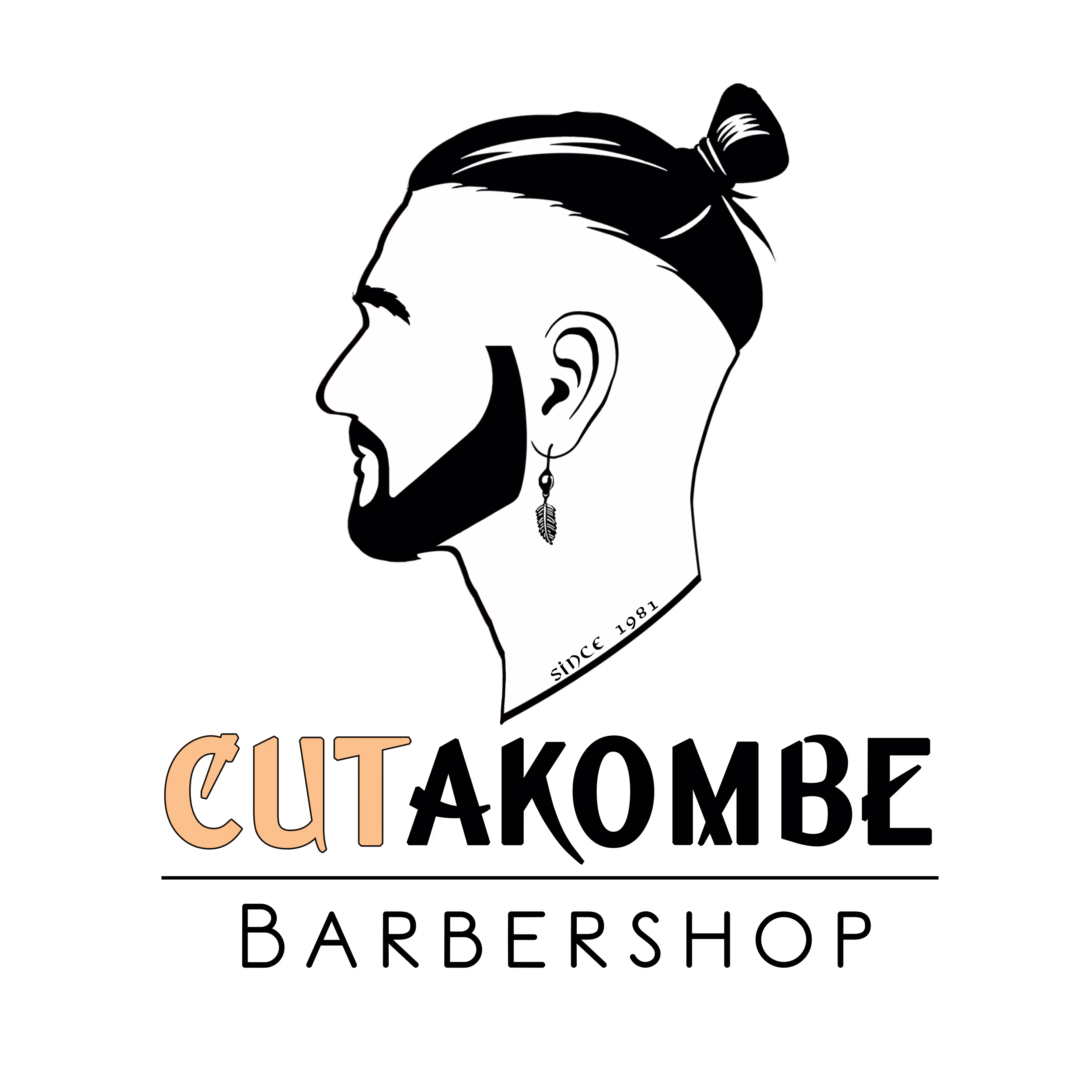 A profile of man with a bun and a well tented beard.