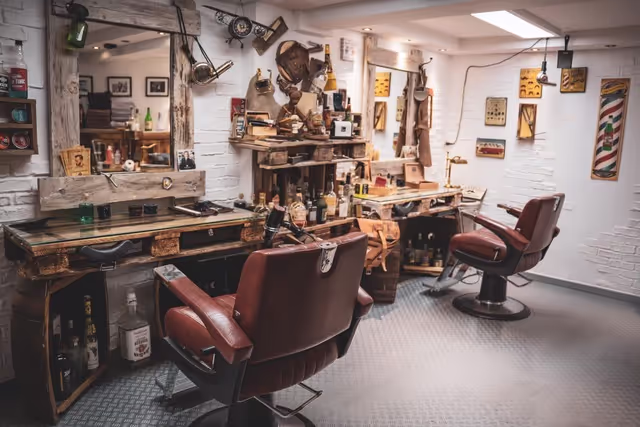 A rustic looking barbershop in a basement